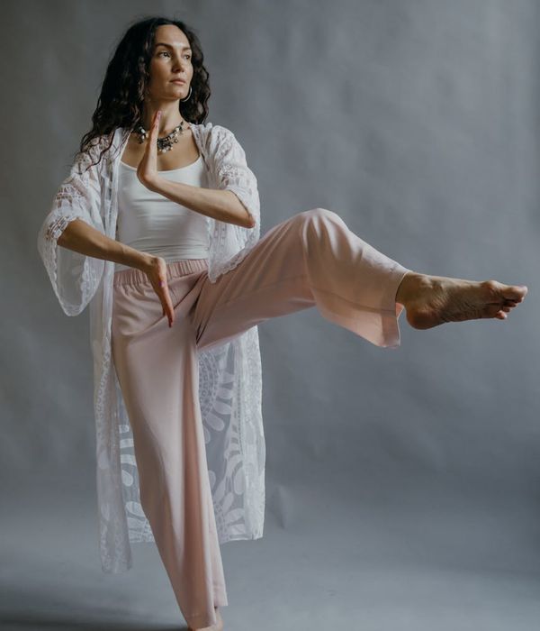 Person practicing gentle yoga movements for better body awareness